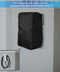 Hella Tough Weatherproof Electric Vehicle Charger Cover For Tesla Wall Connector Level 2 Charging Station, black dust cover mounted on a wall.