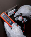 Person using Ultra Handy Electrical Test Kit With Digital Clamp Meter And Non Contact Voltage Tester on outlet