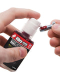 Hands applying Permanent Strength Gel Threadlocker Red For Fasteners Anaerobic Bonding Adhesive 35 Ml Pump to bolt thread