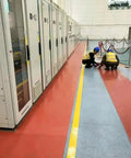 Built Tough Hardcore Commercial Grade Rubber Safety Mat For High Voltage Electric Shock Defense And Solid Grip Shop Shielding Oil Proof Anti Slip Cushion For Switchgear Setup Areas in industrial setting with workers.