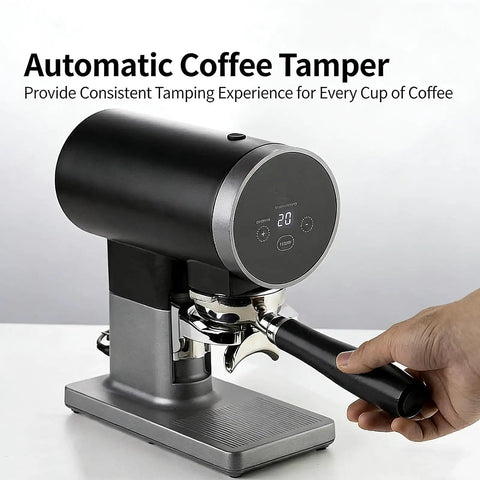 Level Up Your Morning Brew Routine With This Dead Nuts Automatic Coffee Tamper For 58mm Portafilters Featuring Precise Digital Pressure Settings And Totally Consistent Ground Compaction. Black automatic coffee tamper with digital display in use.