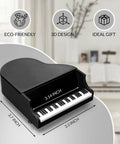 Sturdy Piano Phone Stand For Desk And Bedside Holder That Grips Up To 8 Cm Wide Phones in black piano shape on table