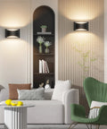 Living room setup with Dope Black Modern LED Wall Sconce Set of 2 Hardwired Indoor Up and Down Wall Mount Lights illuminating space