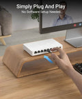 Hand connecting cable to 2.5Gbps 8 Port Unmanaged Ethernet Switch For Gaming And Home Networking, Plug And Play, fanless design.