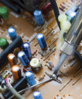 Sixty Forty Rosin Core Solder Wire 0.6mm And 1.5mm Tin Lead being used on electronics circuit board