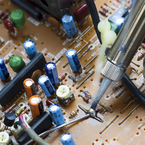 Sixty Forty Rosin Core Solder Wire 0.6mm And 1.5mm Tin Lead being used on electronics circuit board