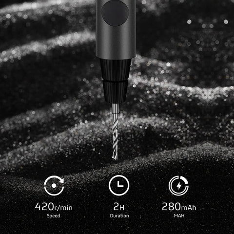 Mini Cordless USB Rechargeable Drill With Eight Attachments Pen Style Portable Power Tool close-up with drill bit on surface