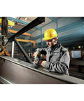 Worker using Beefy Torque 5 Inch Variable Speed Angle Grinder With Electronic Speed Control 2800 To 11000 RPM on metal beam