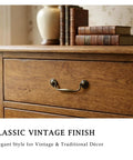 Vintage Bail Drawer Pull Set 4 Pack Antique Brass Cabinet Handles 3.75 Inch on wooden dresser with books on top.