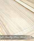 Close-up of unfinished paneled pine wood texture from Unfinished Paneled Pine Bi-Fold Door 30x80 Inches For Closet And Interior Use With Hardware Kit And Handle Built Tough, Barn Style Wood Slab Door For Rustic Modern Homes