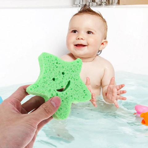 Hand holding Star Shaped Body Scrubber Sponges Set With Quick Drying Wear Resistant Material, child in bathtub in background