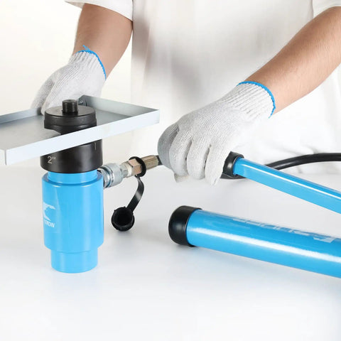 Person demonstrating 15 Ton Hydraulic Knockout Punch Set With 10 Slug Dies From 1/2 Inch To 4 Inch tool, hydraulic pump in use.