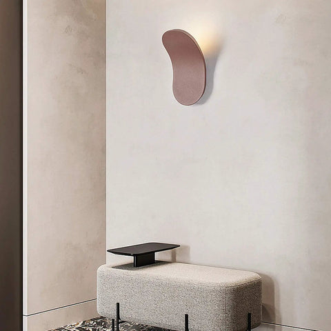Slick Modern LED Wall Sconce For Living Room And Bedroom Featuring Solid Iron Frame With Smooth Acrylic Shade No Hassle Wall Mount Setup For Chill Ambient Lighting And A Total Room Vibe Upgrade Bronze Large mounted on a wall above a minimalistic bench.