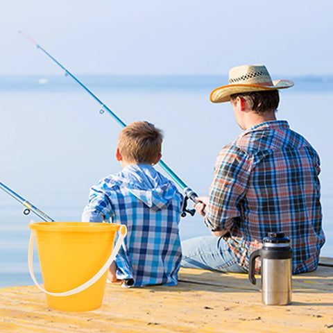 Child and adult fishing on a dock with a yellow bucket, part of 12 Pack 5 Inch Beach Buckets With Shovels Set For Kids Colorful Sand Pails