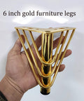 Person holding Heavy Duty 6 Inch Triangle Metal Furniture Leg with gold finish, rubber protector visible