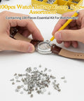 Person using tool on watch with stainless screws nearby, showcasing 100 Piece Watch Screw Kit For Repair And Battery Replacement With Stainless Steel Clamp Screws DIY Friendly Tiny Hardware Set For Watches Precision Screws With Organized Storage For Quick Fixes