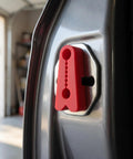 Heavy Duty Silicone Car Door Lock Buffer Pads For Hella Quiet Drives And Zero Rattle With Strong Self Adhesive Backing shown on a vehicle latch.