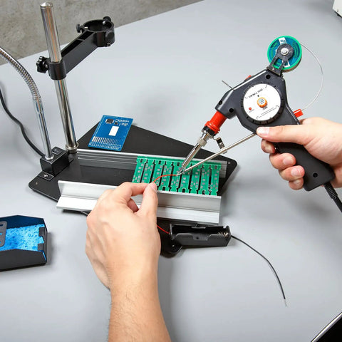 Pro Grade Motorized Automatic Feed Soldering Gun With Variable Temperature 392 To 842 Fahrenheit, 6-In-1 Kit in use on circuit board