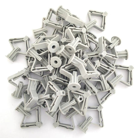 Heavy Duty Drywall Anchor Kit Two Pack With Anti Turn Ribbed Expansion Design For Secure Shelf Mounts In Soft Or Hard Drywall Rust Resistant Self Fasteners For Sturdy Wall Hangs, pile of gray plastic anchors