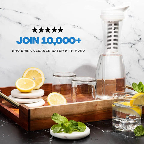 Glass Water Pitcher With Carbon Filter 1.3L Capacity For Fast Filtration Removes Lead Odors Chlorine Long Lasting Filter 2 Pack Included For Crisp Clean Tap Water on wooden tray with lemons and glasses