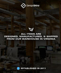 Office interior of Design Skinz warehouse in Virginia with wooden beams and workstations, established in 2011.