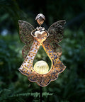 Solar Stake Lights For Garden In Metal Angel Bronze Finish with Warm White LEDs, outdoor decor and memorial light at night.