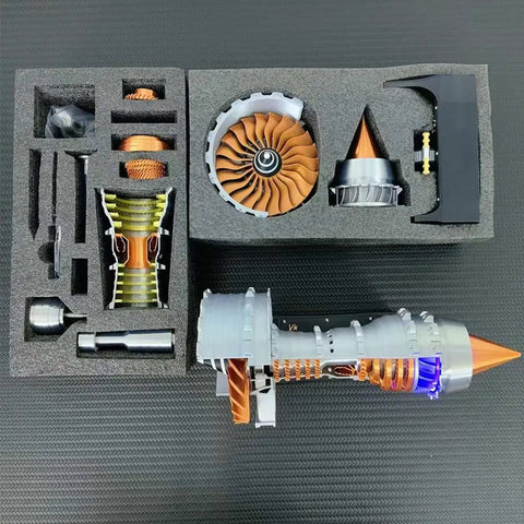 Simulated Turbofan Aircraft Engine Model Kit With LED Light in foam packaging, displaying brass parts and turbine components.