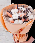 Bouquet wrapped in colorful tissue paper, featuring cotton balls and lavender, showcasing wrapping with Colorful Tissue Paper Pack 150 Sheets.