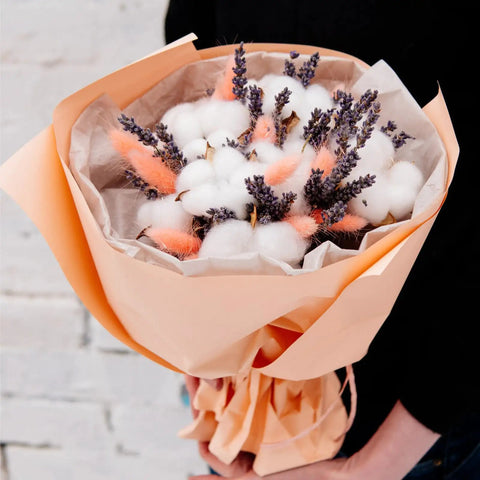 Bouquet wrapped in colorful tissue paper, featuring cotton balls and lavender, showcasing wrapping with Colorful Tissue Paper Pack 150 Sheets.
