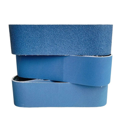 Pro Grade Calcined Aluminum Oxide Sanding Belts Set Of Five Four By Thirty Six Inch Assorted Grit Pack stacked blue belts for metal grinding.