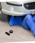Mechanic under car with Spare Tire Hold Down Screw Durable Replacement Bolt For Volkswagen Vehicles With Precise Fit