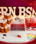 Epic Nursing Graduation Party Supplies Kit 102 Pcs Includes Blood Bag Drink Pouches Empty Pill Bottles 50 Test Tubes Displayed on Table