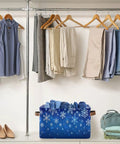 Dang Cool Canvas Storage Basket With Sparkly Winter Snowflake Pattern storing folded clothes under hanging garments in a closet.