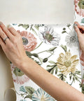 Hands applying Vintage Poppy Pink Peel And Stick Wallpaper For Walls Easy Removable No Mess No Residue Easy Peasy DIY Install