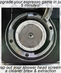 Rock Solid Three Piece Stainless Steel Shower Screen Kit For Dual Boiler Espresso Coffee Maker Heavy Duty Water Diffuser Upgrade Designed For Even Flow And Killer Flavor Extraction Quick Snap Install close-up of the stainless steel shower screen in espresso machine.