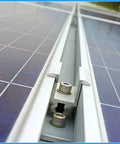 Close-up of 12 Pack Aluminum Solar Panel Mid Clamps 1.06 Inch For Secure Mounting, showing screws and aluminum brackets on panels.