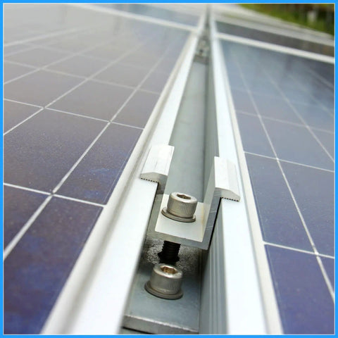 Close-up of 12 Pack Aluminum Solar Panel Mid Clamps 1.06 Inch For Secure Mounting, showing screws and aluminum brackets on panels.