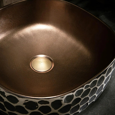 USZWBY Bathroom Vessel Sink 16.9 X 5.9 Inch Bathroom Sink Ceramic Vessel Sink with a unique black and gold design.