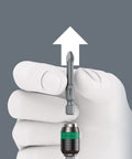 Hand holding bit from Kraftform Kompakt Turbo 19-Piece Screwdriver Set with mechanical turbo boost and push button activation.