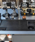 Heavy Duty Stainless Steel Bar Glass Rinser With High Pressure Flush Nozzle And Quick Drain Drip Tray Smooth Coffee Brewing Setup For Zero Splash Cups At Home Or Tap Room, top view on countertop with brewing equipment.