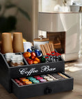 Coffee Station Organizer With Drawer For Countertop Farmhouse Wood Bar Accessory Pods Holder For K Cups Tea Bags Sugar Packets Cups Stirrers Condiments And More Storage Basket With Adjustable Shelves on a counter with cups and pods visible