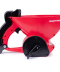 Side view of a Red Ergonomic Hand Spreader With Built In Armrest And Trigger For Comfort Adjustable Reel Control Sealed Gearbox