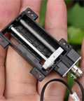 5 Pcs Heavy Duty Linear Actuator 30mm Stroke showing internal mechanism in hand, suitable for DIY projects and automation.