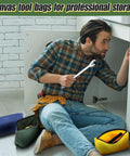 Man using tools with Must-Have Six Color Canvas Tool Bags Set 11.2x7 Inch Heavy Duty Zipper Pouches nearby on floor.