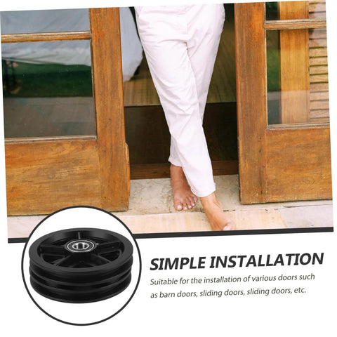 A Pair Of Heavy Duty Replacement Pulley Wheels For Sliding Barn Doors And Metal Gates Built For Roll Like Butter Performance With Sealed Bearings And Zero Hassle Everyday Reliability installed on a sliding door.