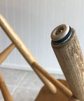 Heavy Duty 7/8 Inch Round Furniture Sliders Featuring Zero Friction Glide Tech For Slick Carpet And Wood Floor Moves While Shielding Surfaces From Scuffs Tan 8 Pack on wooden chair leg.