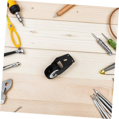 Built Tough Heavy Duty Sliding Door Wheels Featuring Whisper Quiet Rollers For Barn Door Hardware on wooden surface with tools.