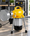 Hella Powerful 500W Electric Drain Auger Machine With 66 Feet Heavy Duty Steel Cable and Pro Sewer Snake Pipe Unclogger in a workshop.