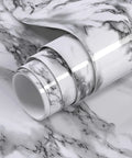 Close-up of rolled Black And White Marble Peel And Stick Wallpaper For Kitchen Counters And Backsplashes No Glue Needed