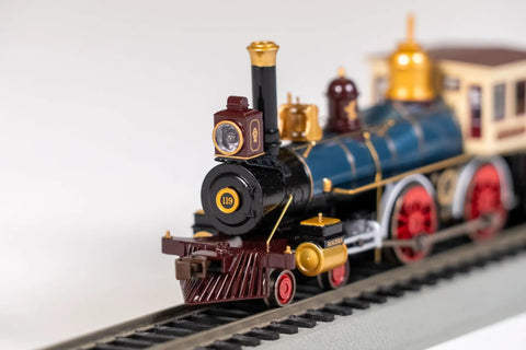 Close-up of 4-4-0 American Steam Locomotive With DCC Ready System Union Pacific 119 HO Scale Wood Load EZ Mate Couplers on track.
